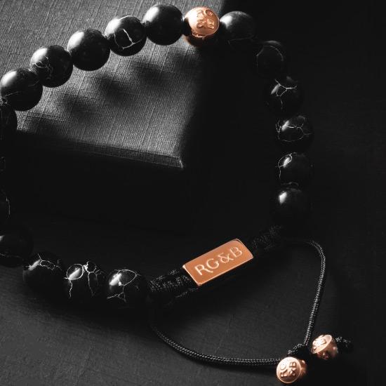 Premium Black Stone Bead Bracelet - Our Premium Black Stone Bead Bracelet Features Natural Stones, Waxed Cord and Polished Rose Gold Steel Hardware. A Beautiful Addition to any Collection.
